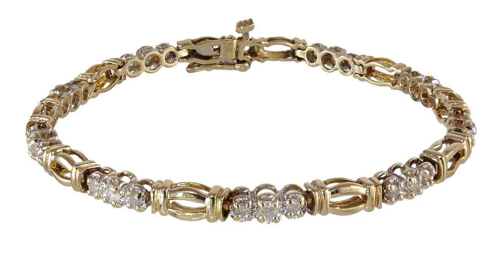 Appraisal: DIAMOND TENNIS BRACELET K yellow gold bracelet contains round full