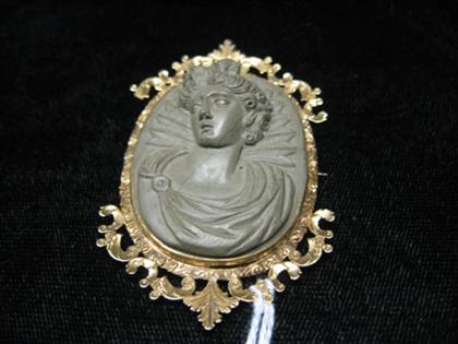 Appraisal: Lava cameo pin of a classical sinistral profile in an