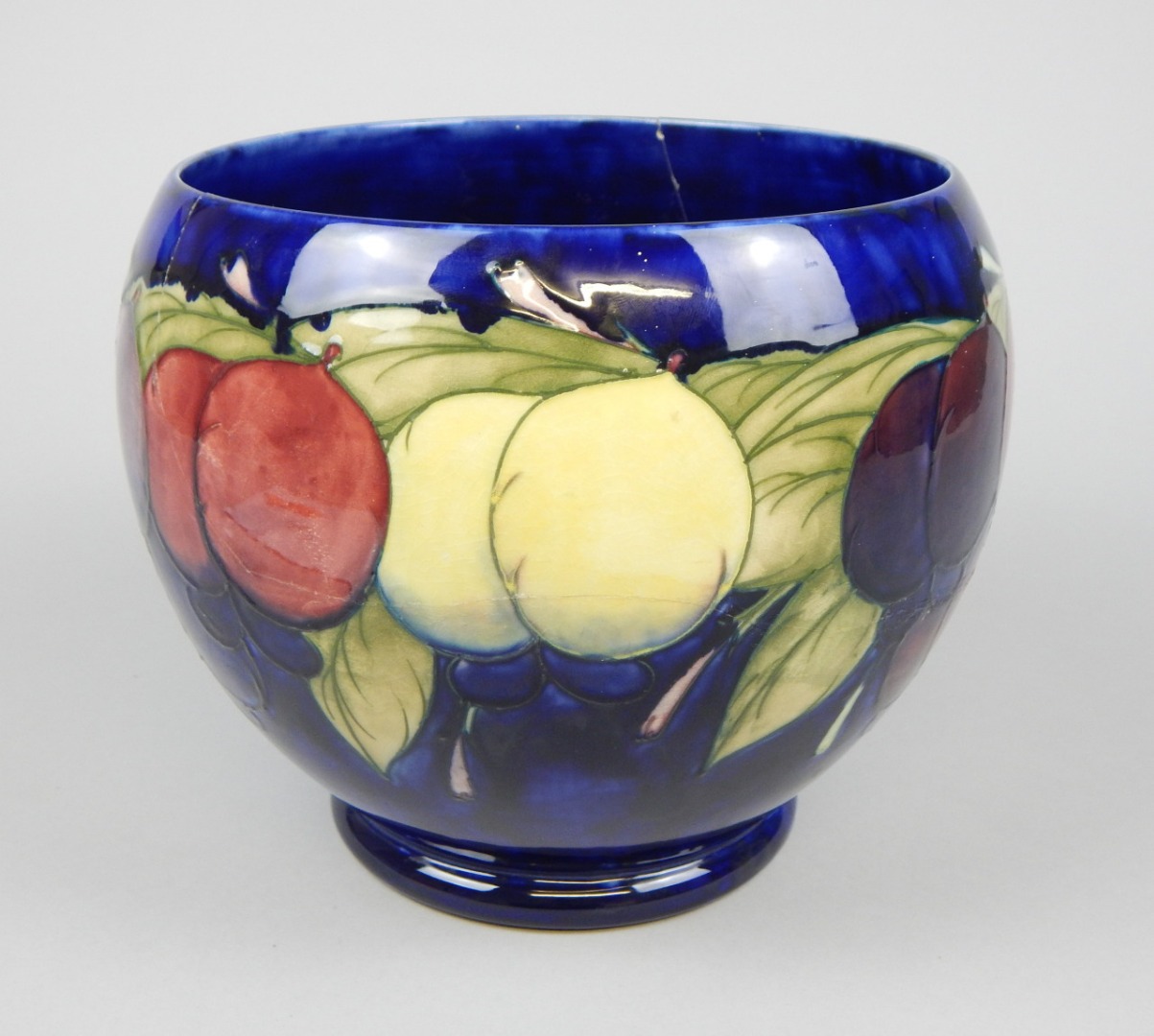 Appraisal: A Moorcroft Wisteria pattern jardiniere decorated in typical tube lining