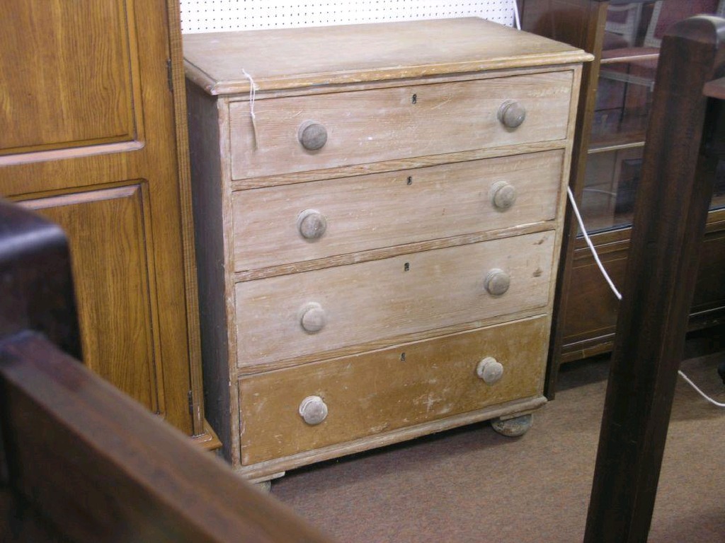 Appraisal: A Victorian stripped pine chest four long drawers each with