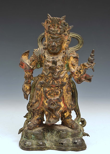 Appraisal: A CHINESE GILT BRONZE SCULPTURE of Kuan Ti in warrior