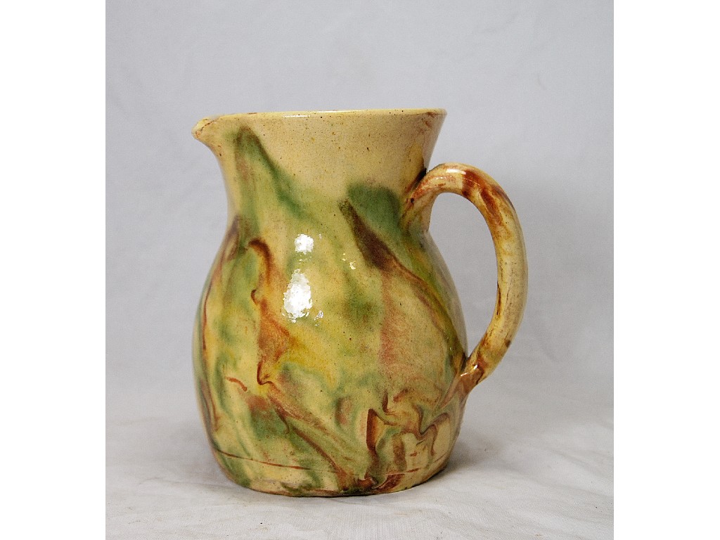 Appraisal: A rustic earthenware jug with marbled glaze in Whieldon manner