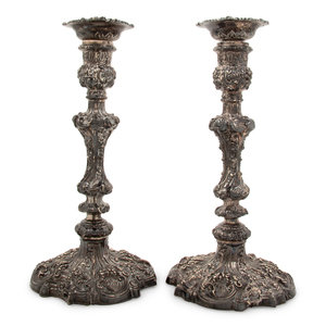 Appraisal: A Pair of Edwardian Silver Candlesticks Walker Hall Chester weighted