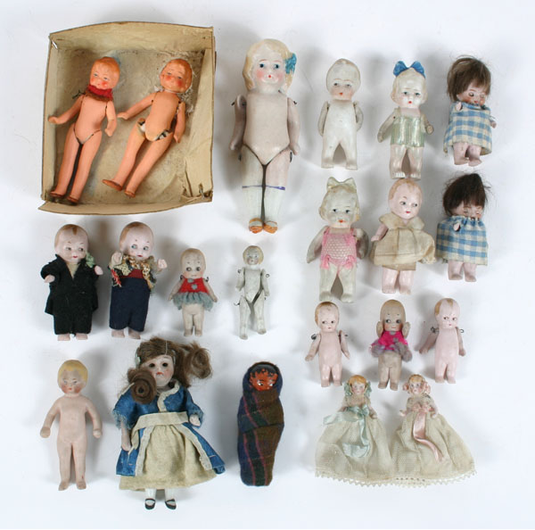 Appraisal: Lot miniature dolls celluloid and bisque most dressed skookum googly