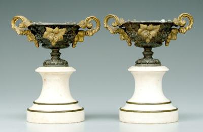 Appraisal: Pair cast metal urns marble bases - in Probably filled