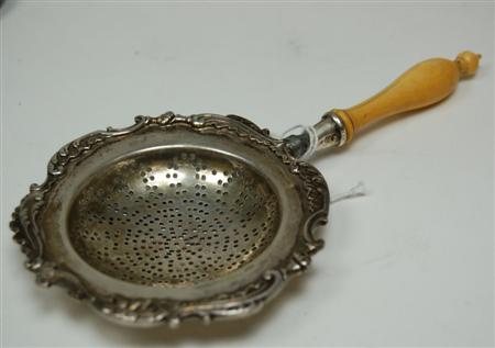 Appraisal: A Faberg silver tea strainer Moscow circa with a turned