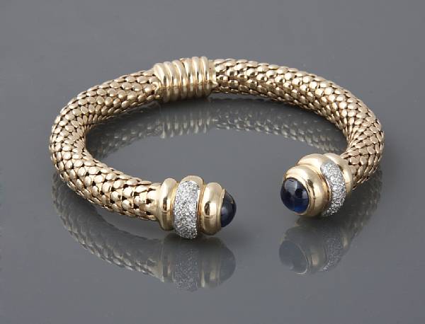 Appraisal: A sapphire cabochon diamond and k gold bangle with spring