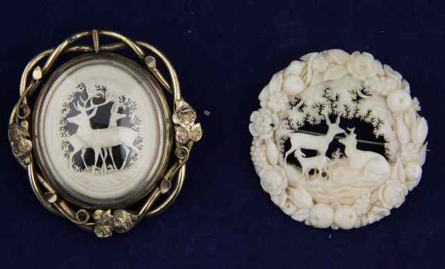 Appraisal: A Victorian carved ivory brooch depicting deer in a landscape