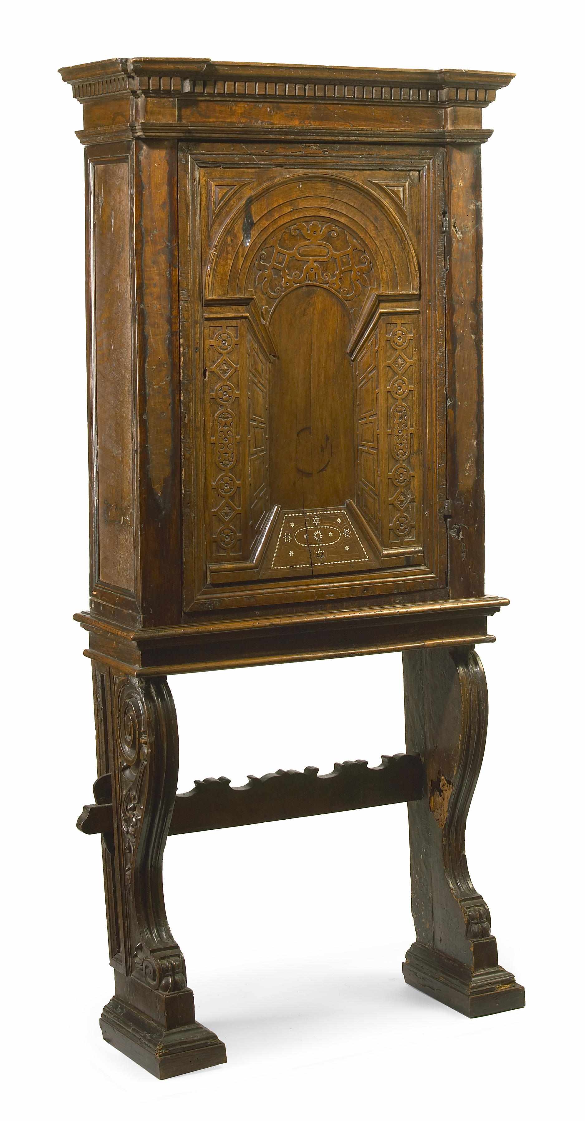 Appraisal: An Italian Renaissance Revival ivory inlaid carved walnut cabinet on