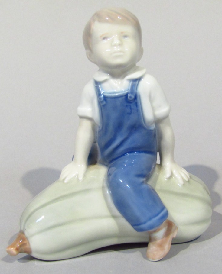 Appraisal: A thC Royal Copenhagen figure no of a boy astride