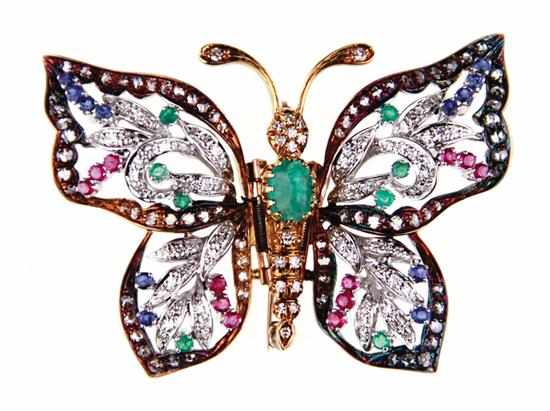 Appraisal: Emerald diamond and sapphire set gold butterfly brooch emerald and