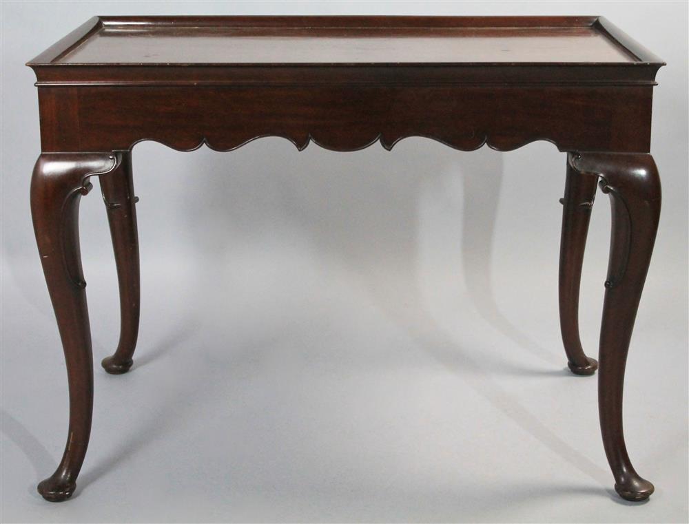 Appraisal: QUEEN ANNE STYLE CARVED MAHOGANY TEA TABLE having a rectangular