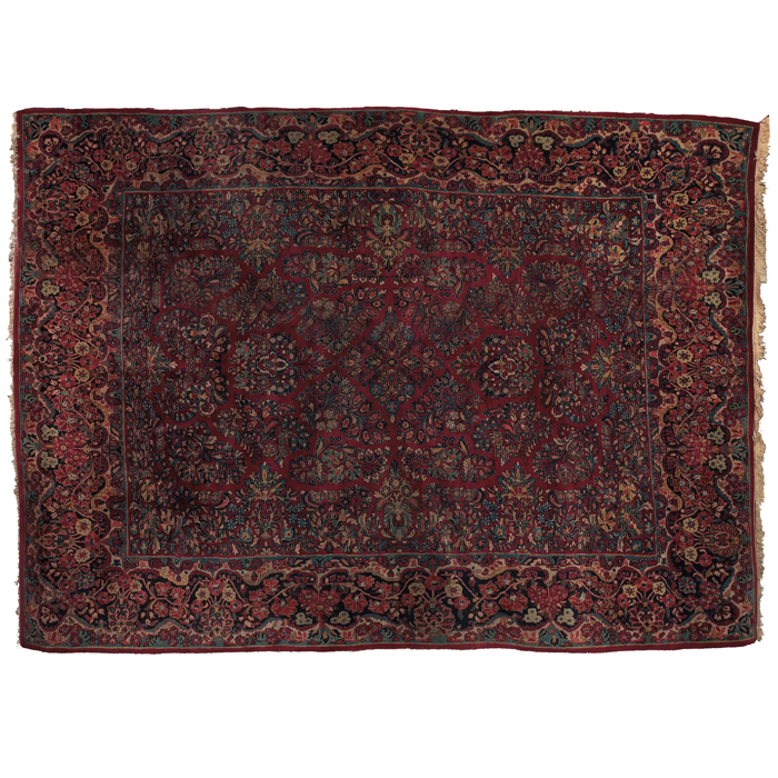 Appraisal: Sarouk rug c floral design on a red field some