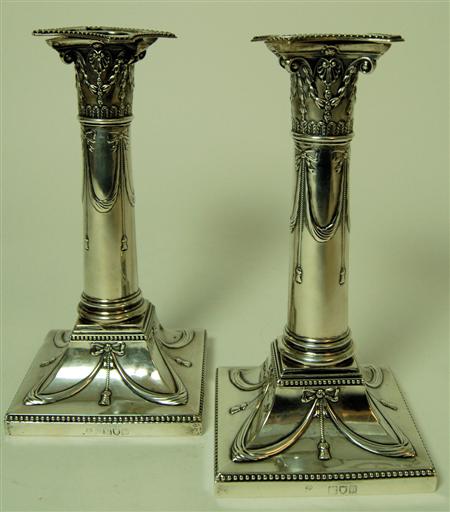 Appraisal: A pair of Victorian silver table candlesticks London makers mark