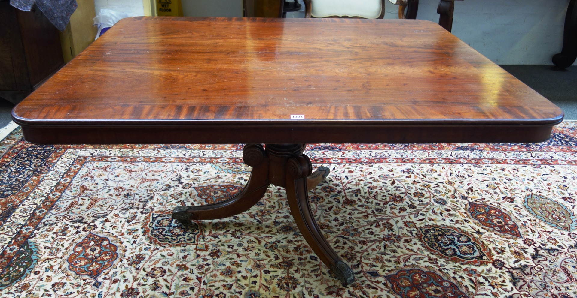 Appraisal: A George III mahogany rectangular snap top breakfast table on