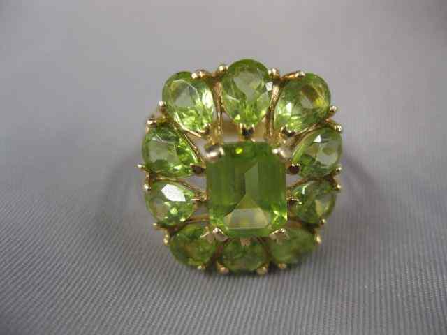 Appraisal: Peridot Ring emerald cut gem surrounded by pear shaped gems