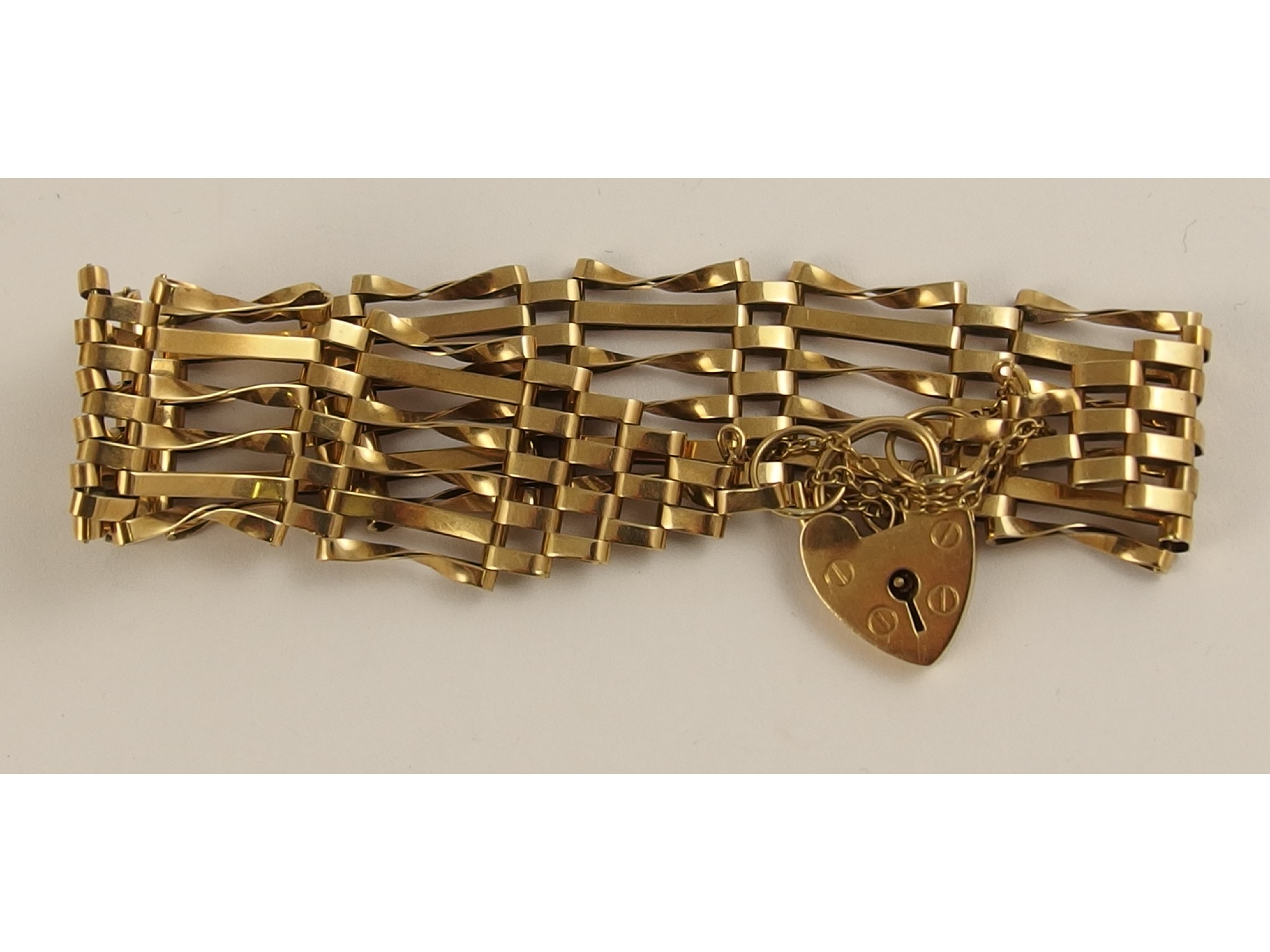 Appraisal: A ct gold gate bracelet with heart clasp weight approx