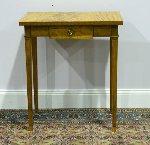 Appraisal: A Biedermeier style satinwood veneer and pine occasional table with