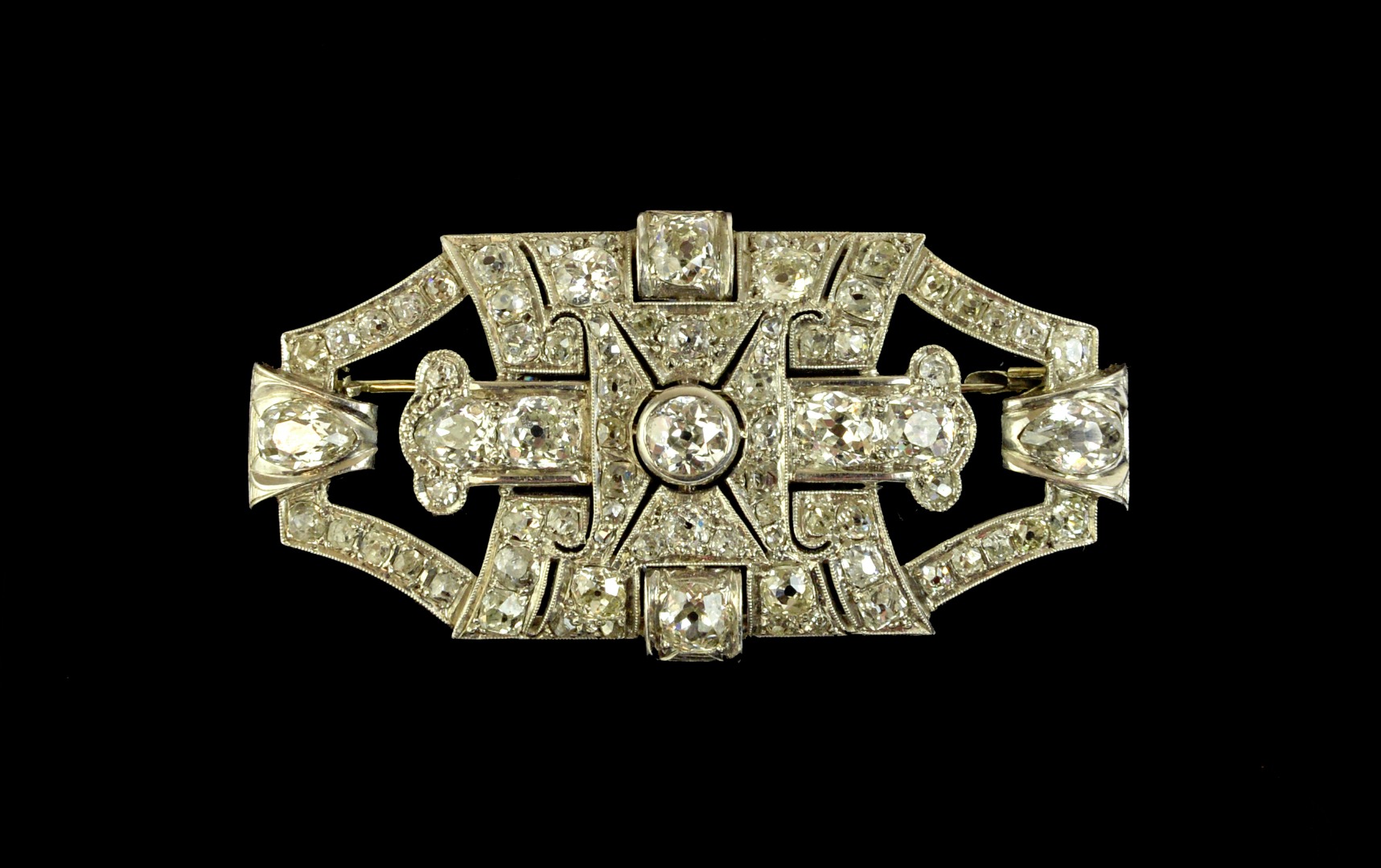 Appraisal: A diamond set brooch in an openwork geometric panel shaped