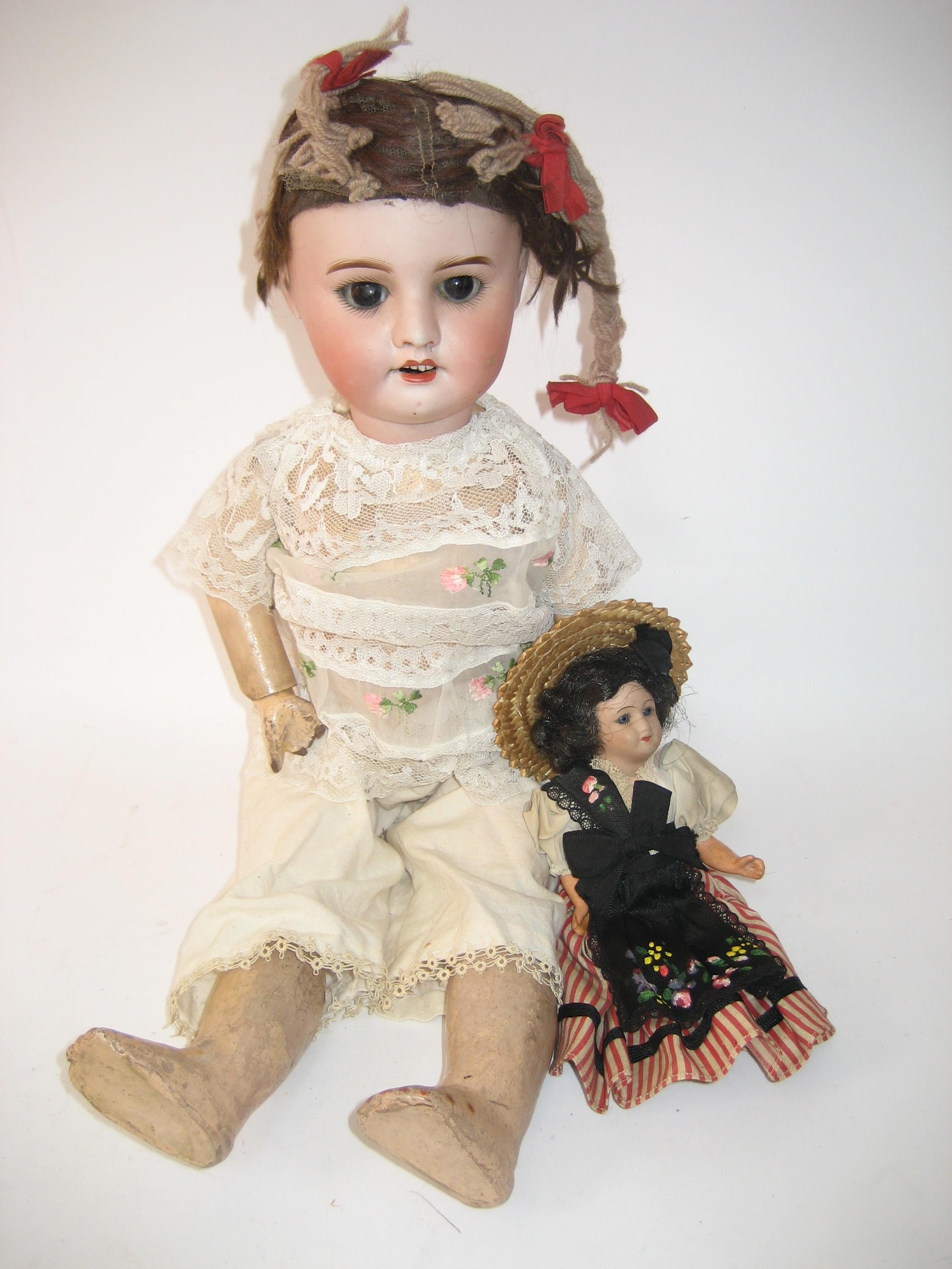 Appraisal: An SFBJ bisque head girl doll with brown glass sleeping