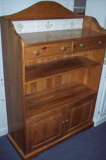 Appraisal: A pine bookcase by Mark Wilkinson fitted two drawers and