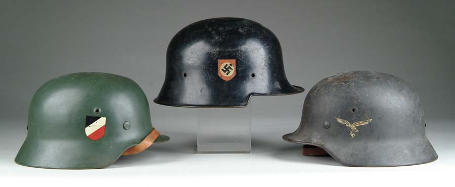 Appraisal: LOT OF THREE NAZI HELMETS Green helmet with German national