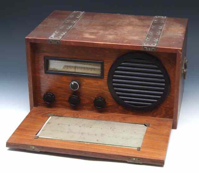 Appraisal: AN OAK CASED AND BRASS BOUND RADIO constructed by Sergeant