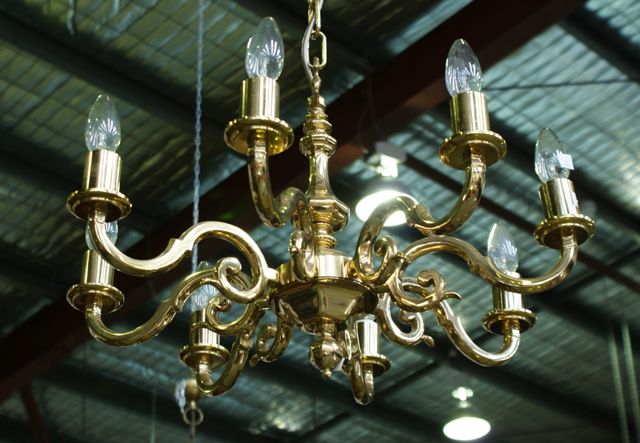 Appraisal: A small brass eight light chandelier