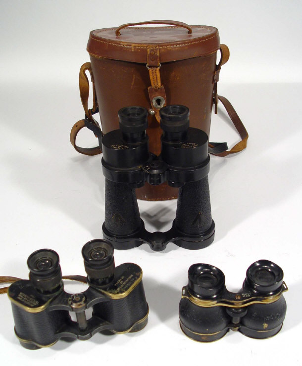 Appraisal: Three pairs of military binoculars one pair in a leather