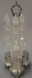 Appraisal: Tantalus having three crystal bottles with silverplated caddy ht in