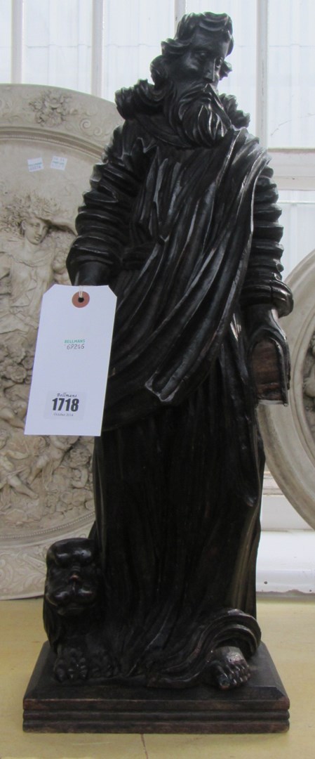 Appraisal: A Bohemian ebonised wood figure of St Mark early th