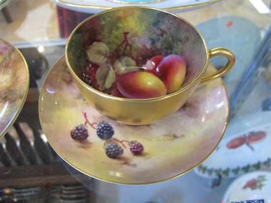 Appraisal: ROYAL WORCESTER HAND PAINTED FRUIT AND BERRIES CUP AND SAUCER