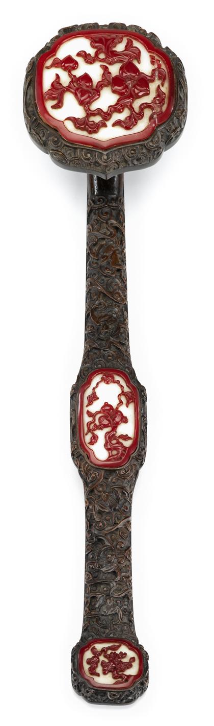 Appraisal: Chinese red on white glass plaque mounted hardwood ruyi scepterTypical