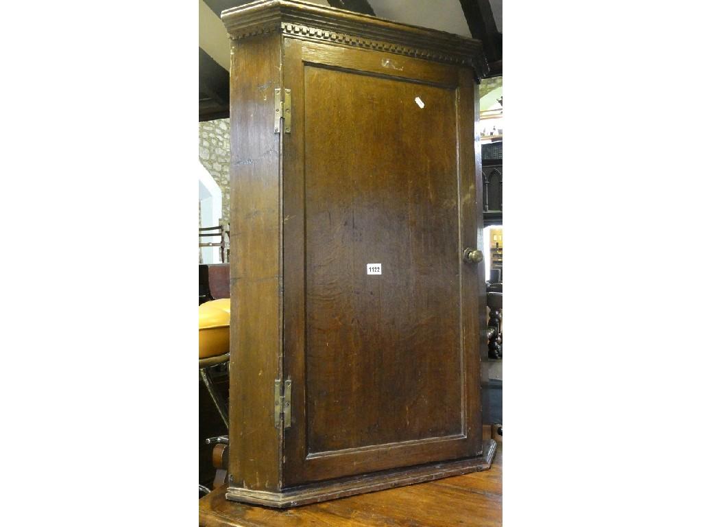 Appraisal: A th century oak hanging corner cupboard the stepped and