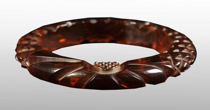 Appraisal: Bakelite Root Beer Colored Floral Carved Bracelet Condition Excellent Size