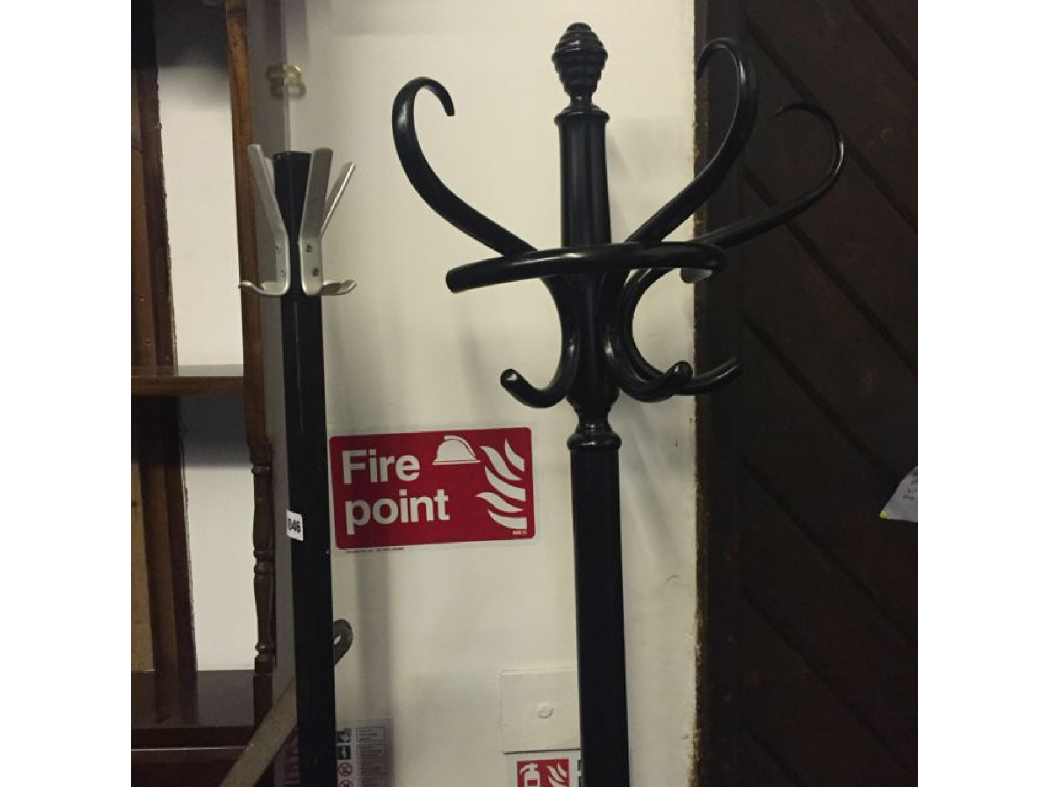 Appraisal: A s ironwork coat and stick stand with x shaped