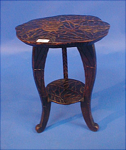 Appraisal: An Arts Crafts carved two-tier table