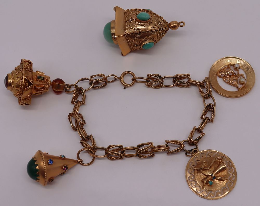 Appraisal: JEWELRY Gold Charm Bracelet and Charms Includes an oversized kt