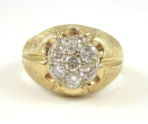 Appraisal: MAN'S DIAMOND AND FOURTEEN KARAT GOLD RING set with seven