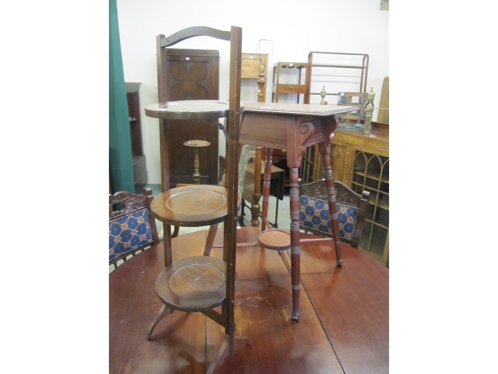 Appraisal: Two mahogany occasional tables and a mahogany folding cakestand