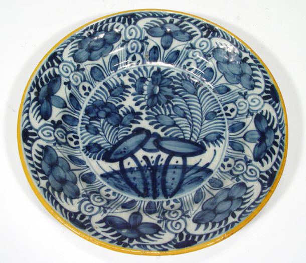 Appraisal: th Century English Delft pottery plate painted with blue flowers