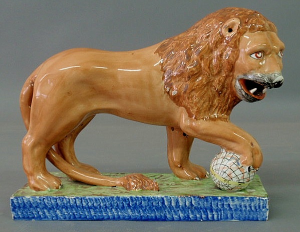 Appraisal: Fine Staffordshire standing lion with orb and standing on a