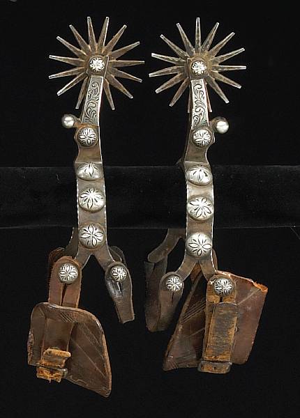 Appraisal: A pair of double-mounted and silver inlaid California style spurs