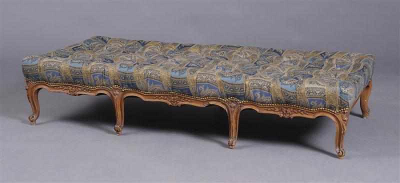 Appraisal: LOUIS XV STYLE CARVED WALNUT BANQUETTE The rectangular buttoned upholstered