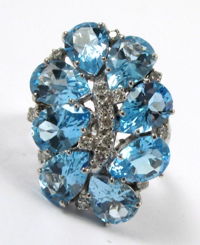 Appraisal: BLUE TOPAZ AND DIAMOND RING k white gold set with