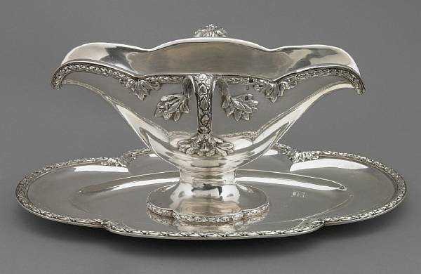 Appraisal: A French standard silver sauceboat with attached undertray Applied border