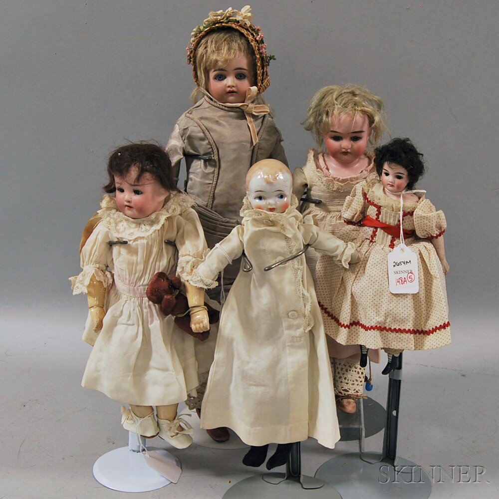 Appraisal: One Small China and Four Bisque Head Dolls Japan and