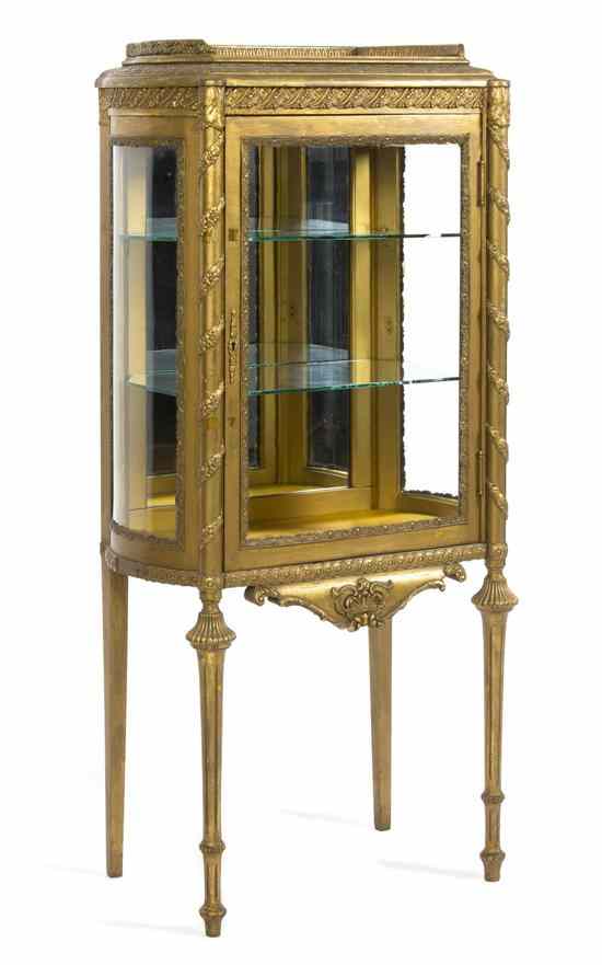 Appraisal: A Neoclassical Style Giltwood Vitrine Cabinet having a three-quarter galleried