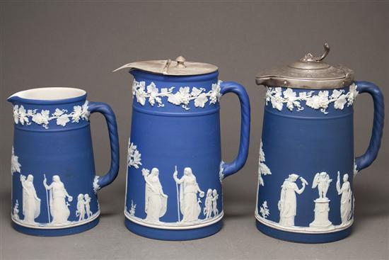 Appraisal: Three Wedgwood blue and white jasperware jugs late th early