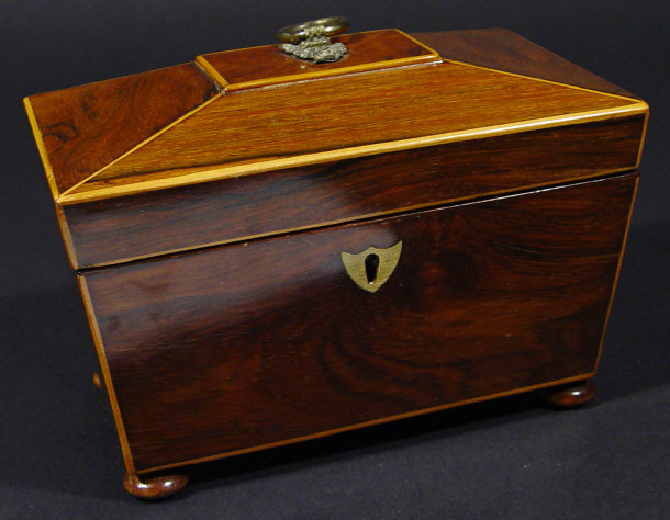 Appraisal: th Century rosewood sarcophagus shaped tea caddy the hinged lid